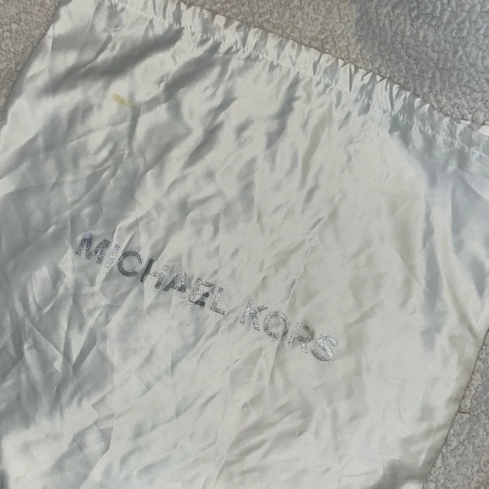 Michael Kors garment bag.